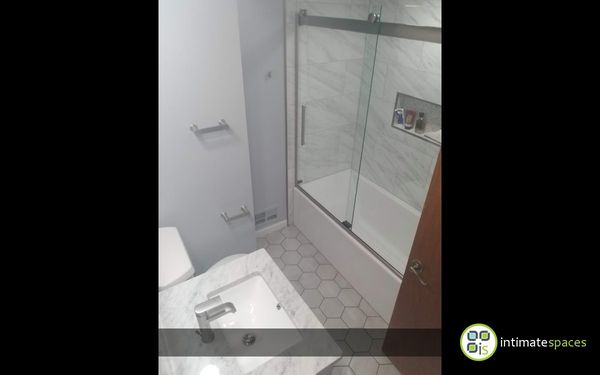 Small Bath Renovation, Soaking Tub w/ Custom Roller Doors, Custom Vanity w/ Granite Countertops, Modern Hex Tile.