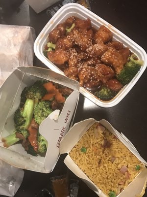 Sesame chicken, beef and broccoli and pork fried rice.