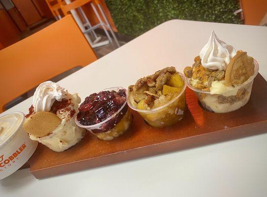 The flight- RED VELVET PUDDING, BLACKBERRY COBBLER, CARAMEL PEACH COBBLER, SNICKERDOODLE COOKIE pudding