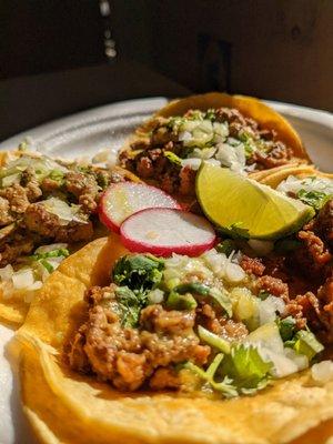 Carne asada and al pastor tacos