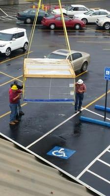 Commercial A/C unit lift from parking lot.