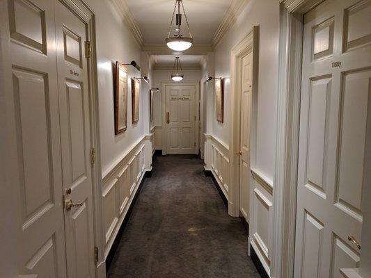 Inside the clubhouse. Hallway between the men's locker room and the Champion's Locker Room.