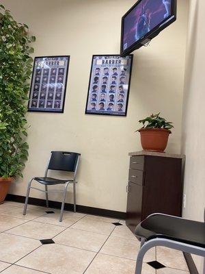 TV and barber posters.