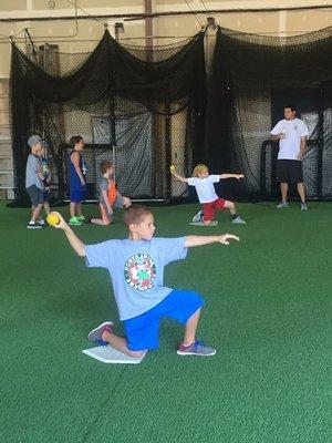 Pitching Coach - Barry Farias working on pitching and throwing mechanics