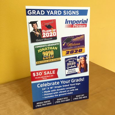 Foam board display about graduation yard signs.