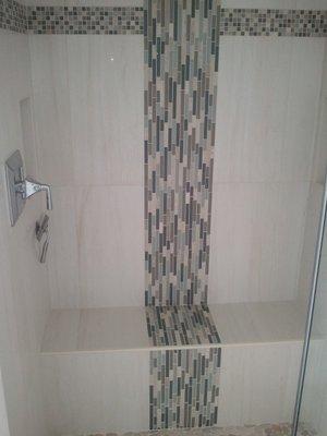 Custom Shower tile with glass tile waterfall.