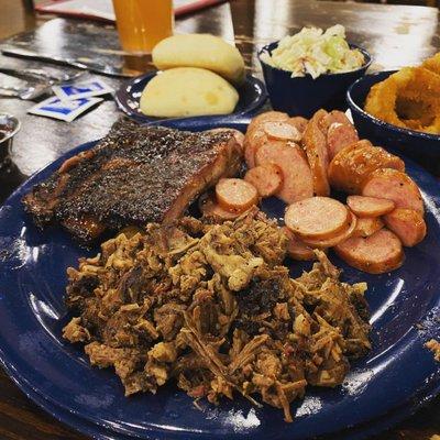 The Tri-City, chopped brisket, house ribs, and non spicy sausage