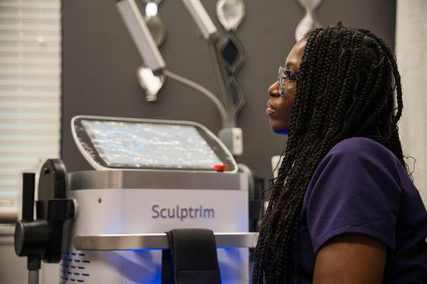 Doctor Ubong Prince, our medical director demonstrating Sculptrim body contouring