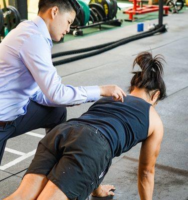 Dr. Woo walking a patient through pain-free exercises