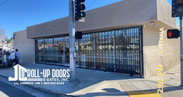 39' x 8' storefront Folding Gate  installation in Fontana, CA.