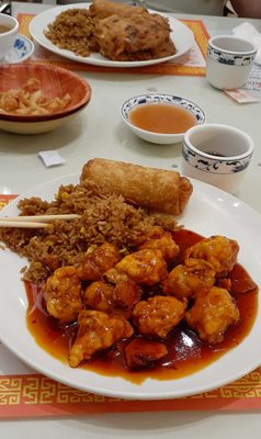 Egg foo young and orange chicken in foreground. Delish.