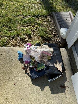 Trash left by property management that they assumed was mine that they neatly folded up and put on top of a contractor trash bag.