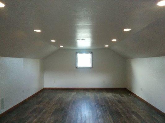 We installed insulation, drywall, textured walls and ceiling, painted, flooring, and trim.