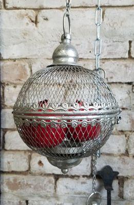 Hanging metal globes and lanterns.