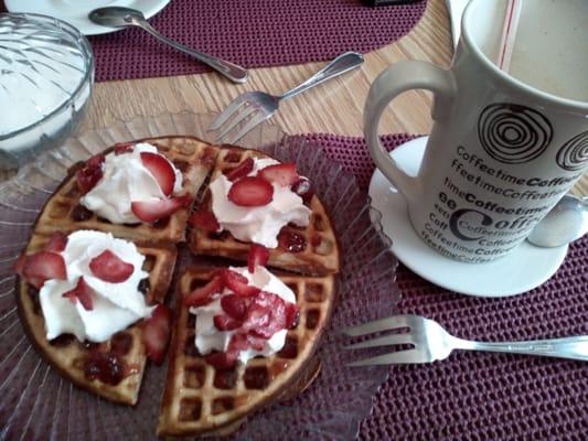 Waffles with strawberries. Frozen coffee. Pretty good little cafe!