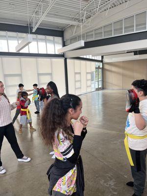 Newly Promoted Yellow Belts going over punch drills