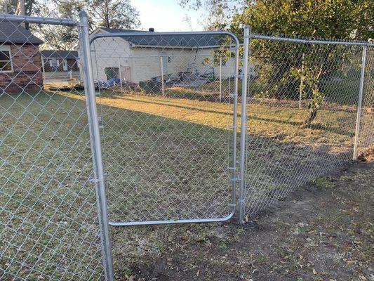 Chain link install with one 4.5' gate and a double driveway gate of 11 feet.