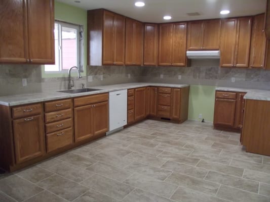 New laminate countertops with Gem-Loc edging and an under mount stainless steel sink.