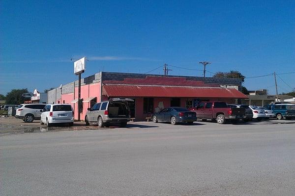 Alamo Restaurant, the Pink Restaurant, next door to a bakery.