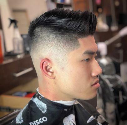 Skin fade with pomade on hair to style the hair