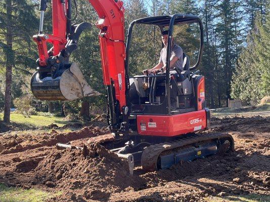 Graded an abrupt hillside on this customers property. Increased the usable land on the property by adding fill dirt and grading the land.