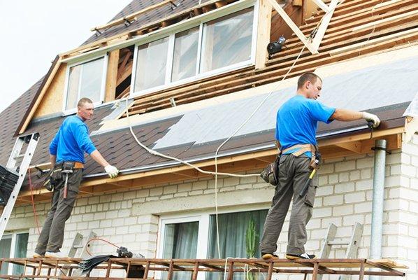 Roofers in action