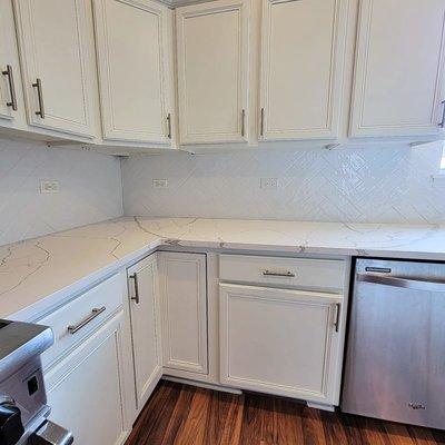 Herringbone backsplash with subway tile.