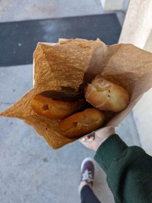 Two filled donuts and a bonus free donut