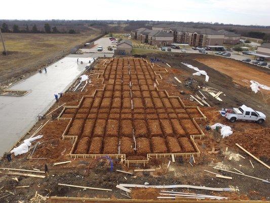 Multi-Family apartment foundation and parking lot.