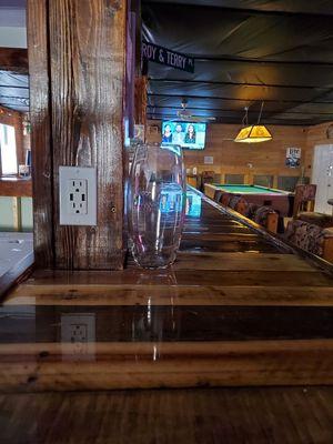 The bar top, made of pallet wood.