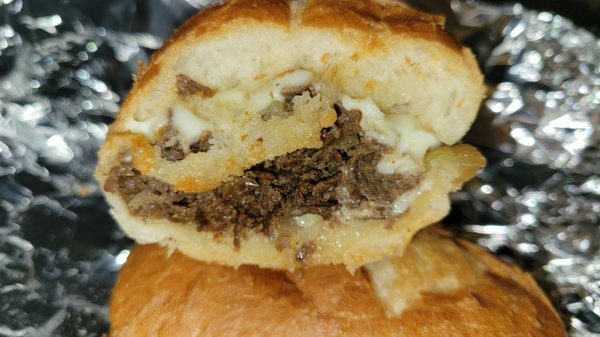 Reg philly steak and cheese w/provolone and grilled onions, no tomatoes or lettuce