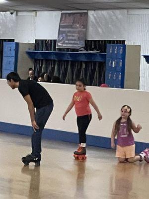 Kids learning to skate and having fun