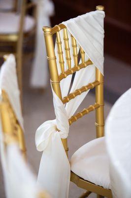 Gold chiavari chair with ivory sash