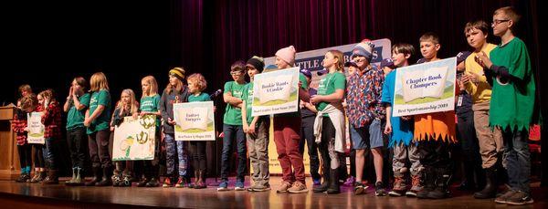 Battle of the Books teams on stage at the annual competition.