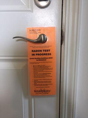 Radon Test in Progress notifications are posted at every exterior door