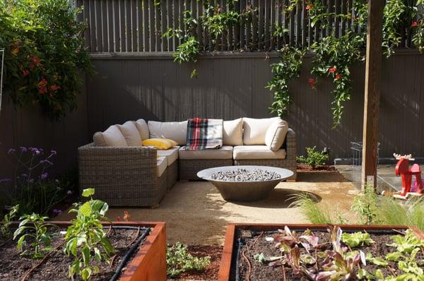 extending the outdoors with fire and raised veggie beds.