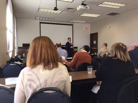 Reid lecturing to the Idaho State Bar's Business and Corporate Law Section.