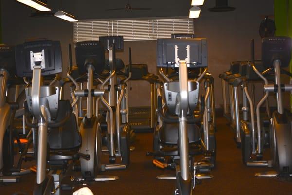 our cardio area, equipped with individual tv's and full cable network.  Our cardio area separate from our weight area too!