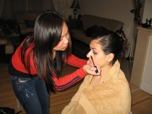 Jackie doing my make up for my uncle's B-day party