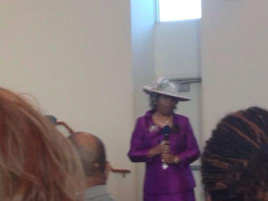 Pastors mother speaking at his anniversary