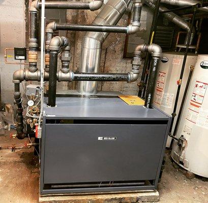 Steam boiler replacement utilizing drop header configuration for dryer steam (Park slope Brooklyn)