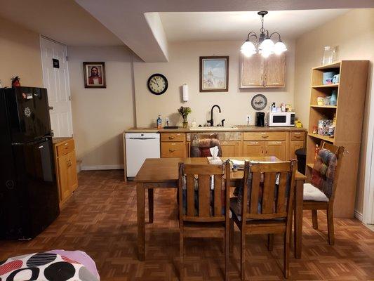 Kitchen and dining area includes resident refrigerator and other amenities for making small meals and enjoying nutritious snacks.