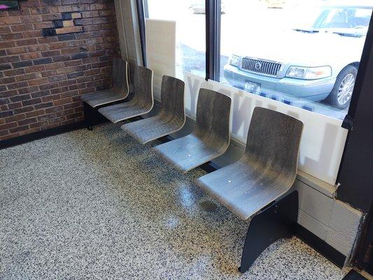 Seats at front and rear of laundromat, no reservations needed. :)