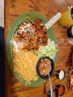 Chori-pollo plate.  Flattened chicken with chorizo then topped with cheese dip.  Side of rice, beans and a salad.