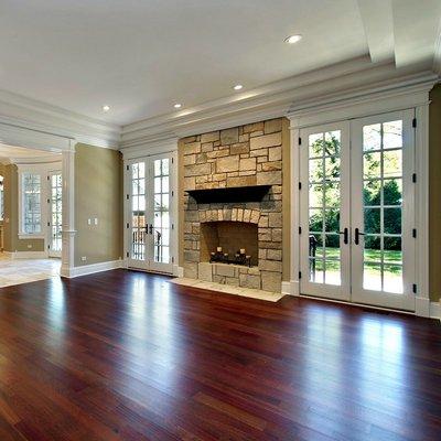 Wood floors look amazing next to the fire place.