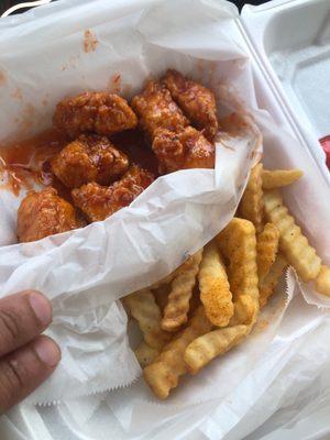 Boneless wings with Thai chili sauce and fries. Mmm!