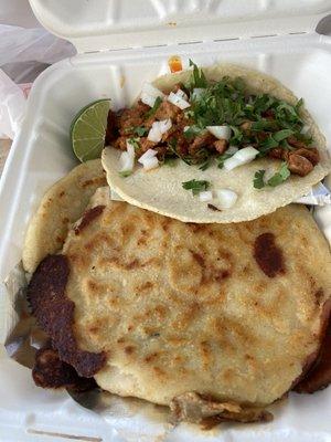 One taco al pastor and two pupusas