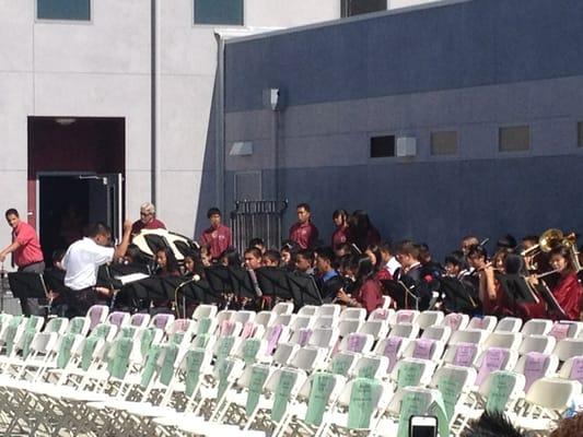 Mr. Charles Ancheta conducts the Columbia Middle School band for the promotion...