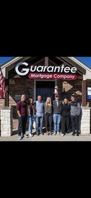 Guarantee Mortgage team in front of college station office.