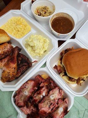 Jerk chicken, rib tips, pull pork, baked beans, potato salad, mac and cheese and cheesy rice.